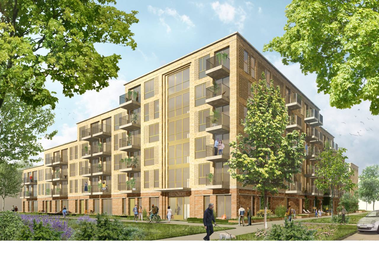 Nieuw modern appartementsgebouw omgeven door groen.